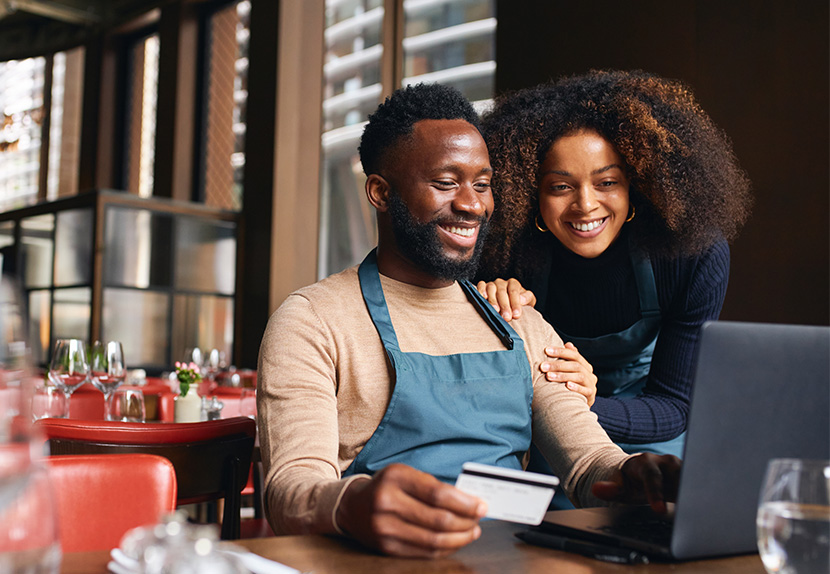 a person holding a debit card or purchasing something