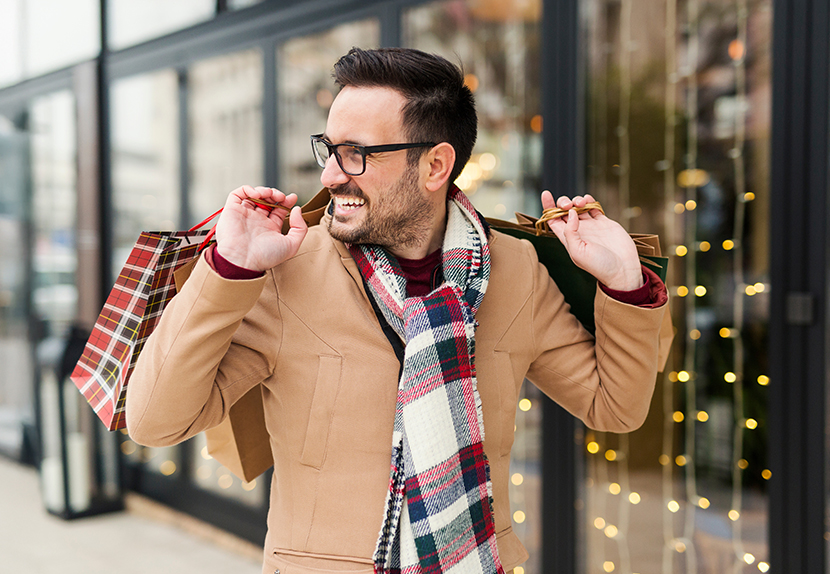 A man happy with holiday shopping 