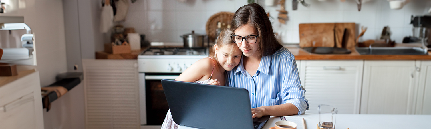 A single mother is with her daughter, searching for budget-friendly tips.