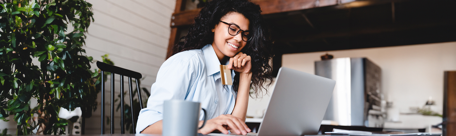A student enrolled in college wears a smile of anticipation as they eagerly prepare to check their credit score.