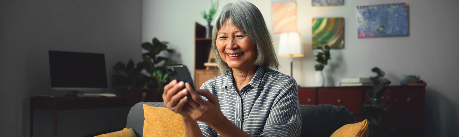 Woman planning healthcare expenses for retirement on her phone