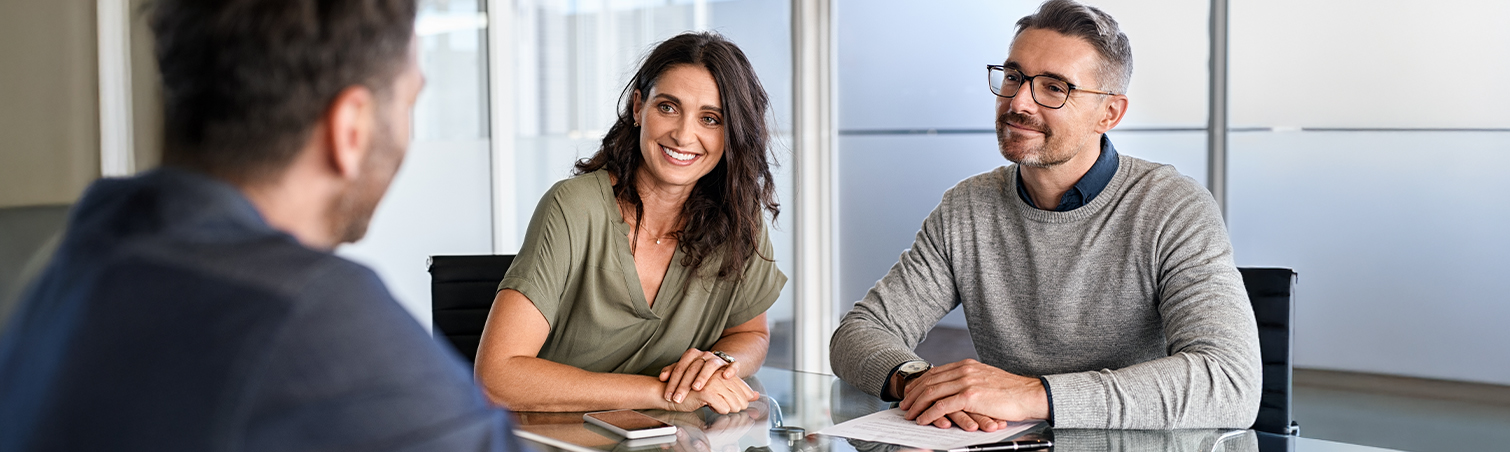 Couple talking to loan officer