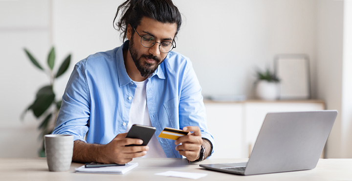 A person is researching how to lower payments on their financial debt.