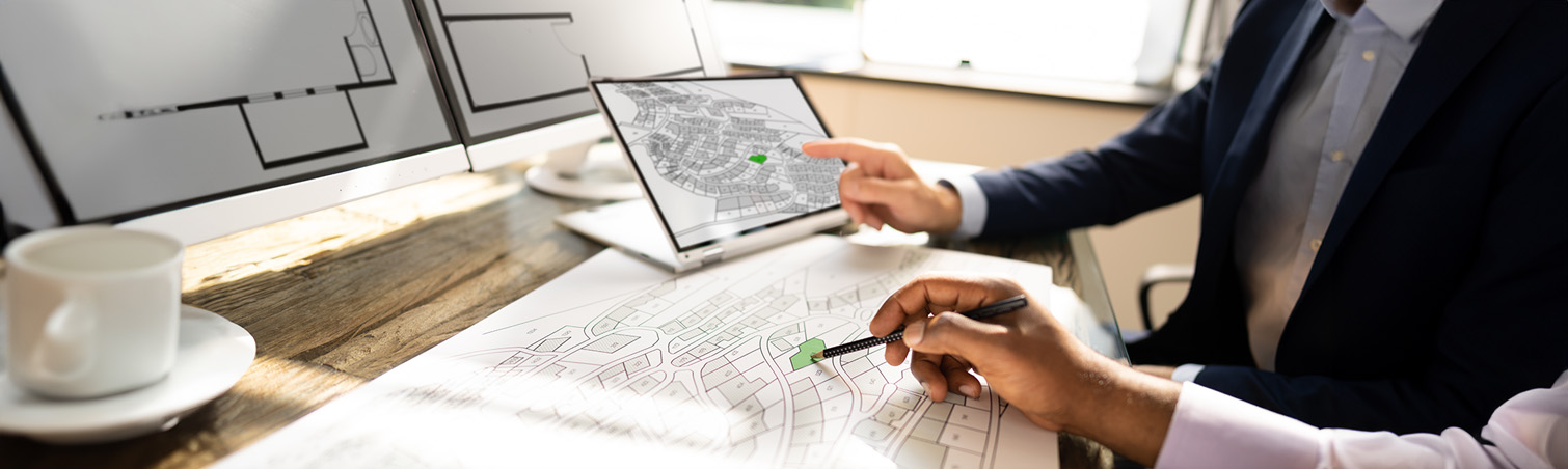 two individuals are looking at remodeling plannings.