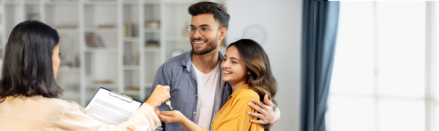 A couple are with their Landmark financial adviser discussing what a down payment is and ways to save.