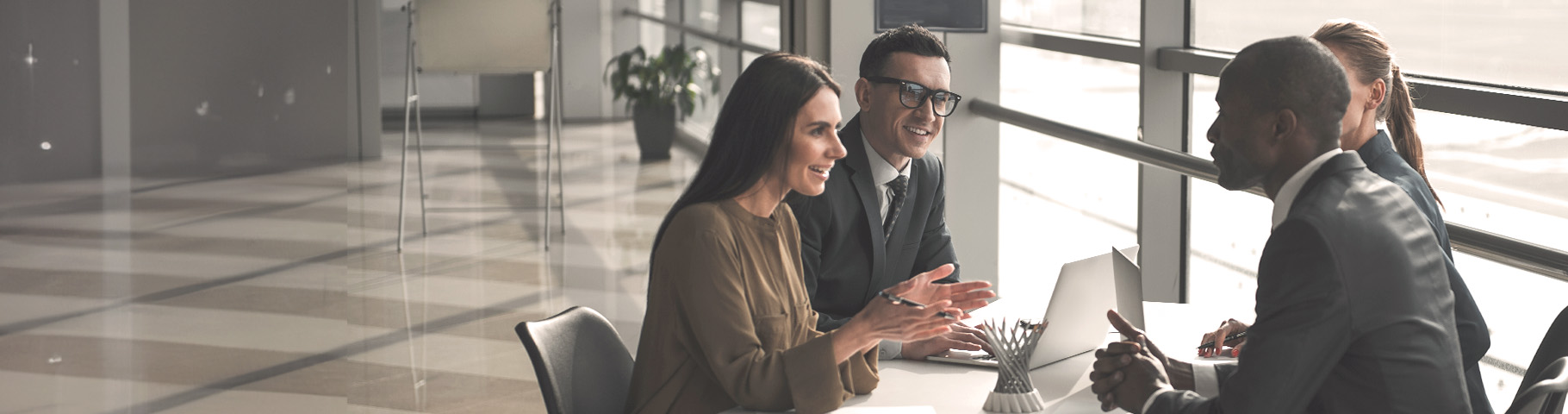 Two business owners applying for business loan at landmark credit union. 