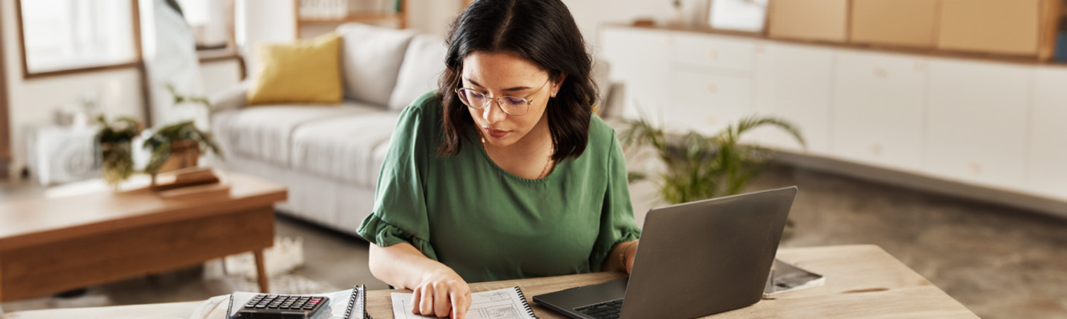 Person reviewing their budget and planning for inflation.